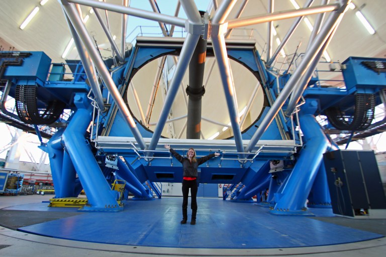 Standing in front of the 8.1-meter mirror