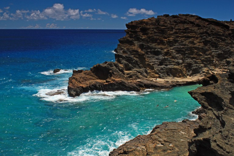 Overlooking the waters from the Halona Blowhole parking lot. We never saw how to get down there, but there are obviously people enjoying the swimming!