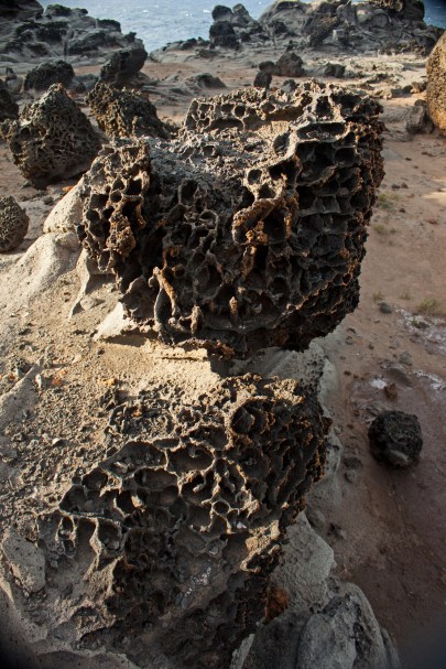 Rocks that look as if they have been washed in acid - the result of years of ocean erosion.