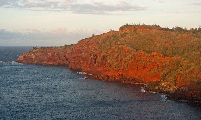 Driving back to Lahaina, the setting sun made these already red rocks look even more vibrant.