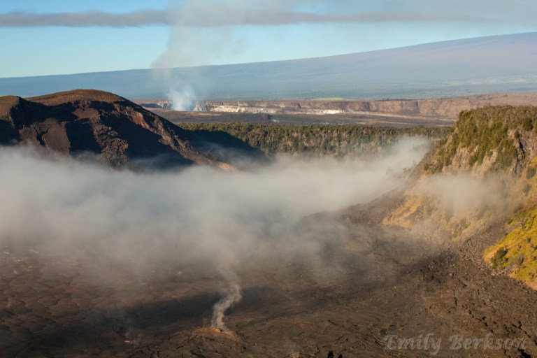 Steam rises from cracks in the lava floor of Kilauea Iki Crater.