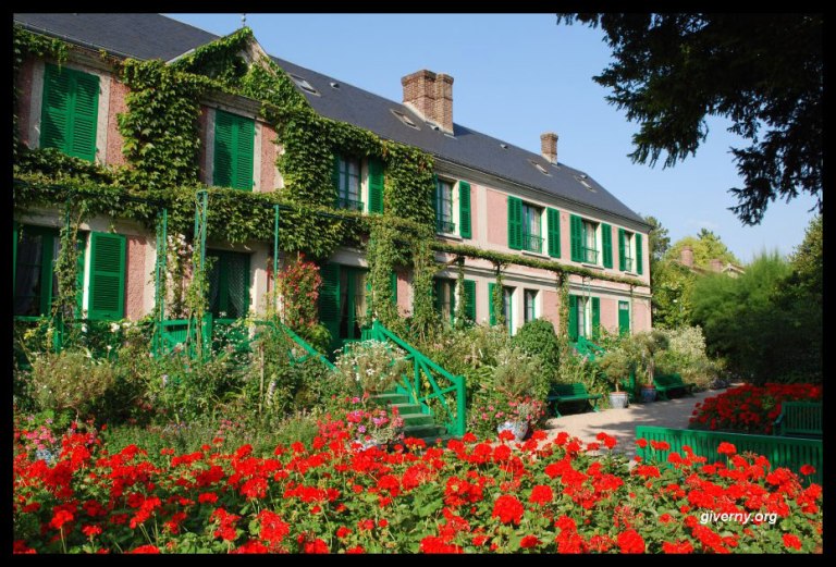 Monet's home, on a much sunnier day than when we visited. (Image Credit: Ariane Cauderlier, http://giverny.org/gardens/fcm/visitgb.htm)