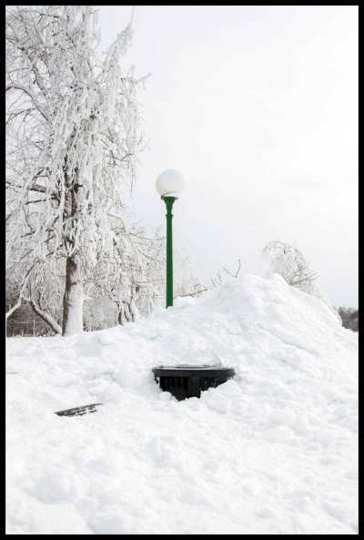 Snow is just shoved off to the side throughout winter, eventually covering the park benches and trash cans. Not that anyone would want to sit outside anyways.