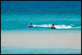 Jet skiers enjoying the day on Lake Ontario.